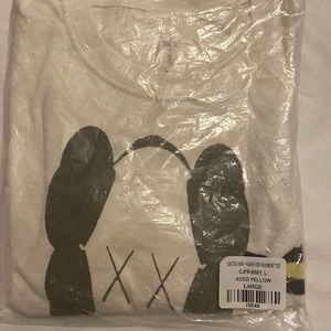 Kaws x Travis Scott tee brand new with tags and sealed in packaging